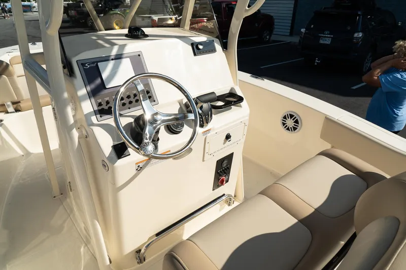 Slide: The Image of 2025 Scout 195 Sportfish boat interior with steering console and seating. - 22