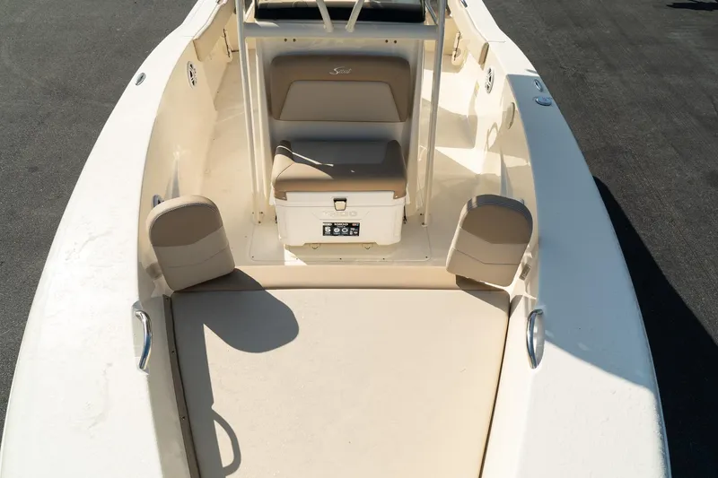 Slide: The Image of 2025 Scout 195 Sportfish boat interior with seating and storage. - 26