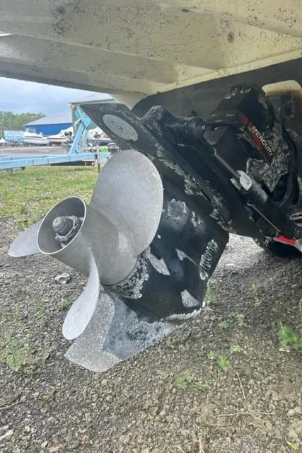 Slide: The Image of 1997 Sea Ray 270 Sundancer boat propeller and stern drive on land. - 3