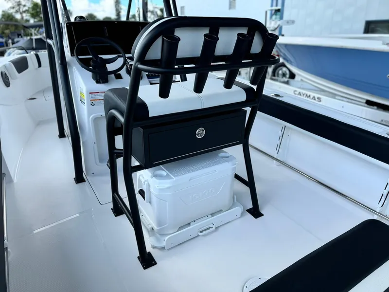 Slide: The Image of 2025 Edgewater 208 CC boat interior with seating and storage. - 7