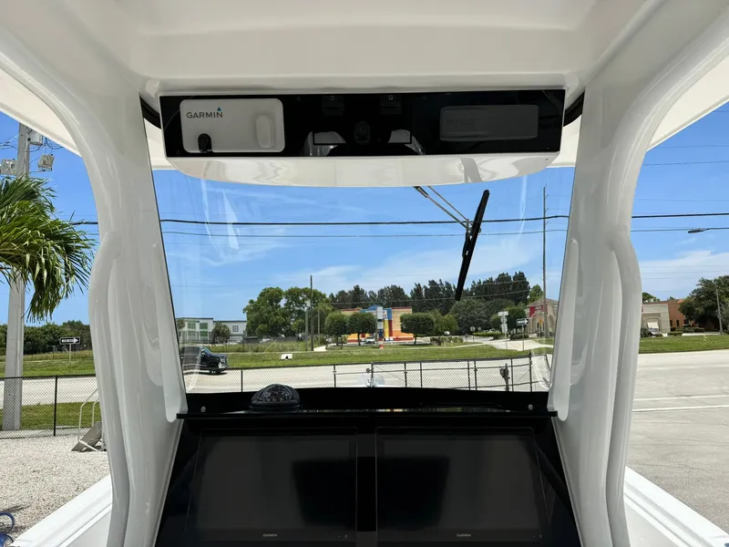 Slide: The Image of 2025 Edgewater 262 CC boat dashboard with Garmin navigation system. - 16