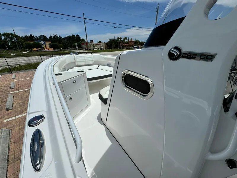 Slide: The Image of 2025 Edgewater 262 CC boat interior with seating and storage compartments. - 20