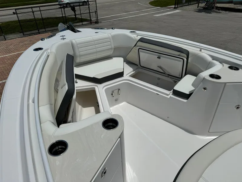 Slide: The Image of 2025 Edgewater 262 CC boat interior with seating and storage compartments. - 29