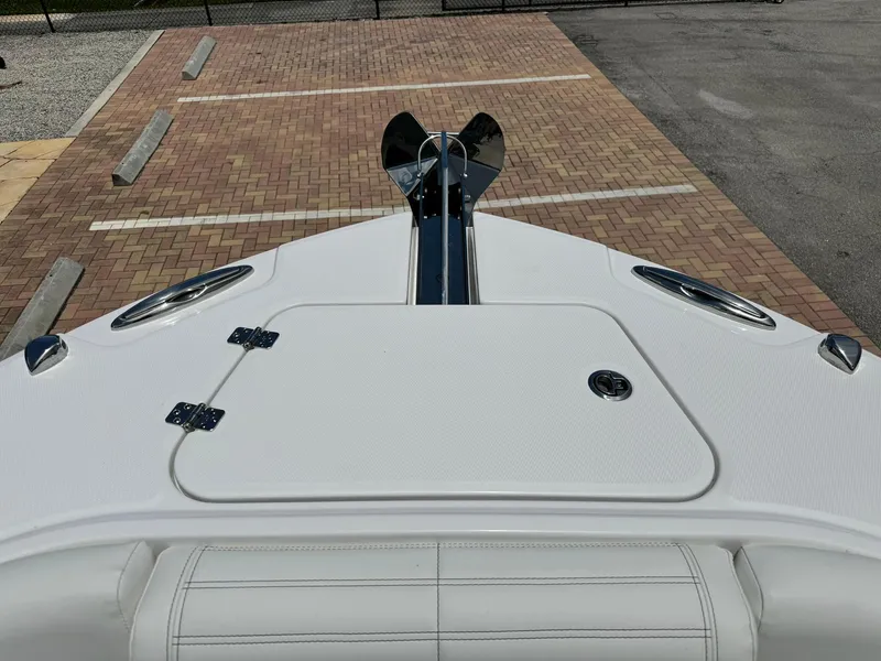 Slide: The Image of 2025 Edgewater 262 CC boat bow view in parking lot. - 30