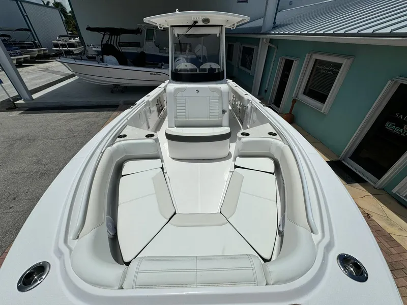 Slide: The Image of 2025 Edgewater 262 CC boat with spacious seating and sleek design. - 33