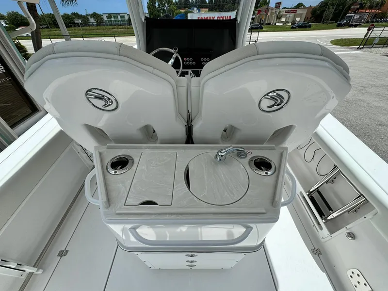 Slide: The Image of 2025 Edgewater 262 CC boat interior with dual seats and console. - 9