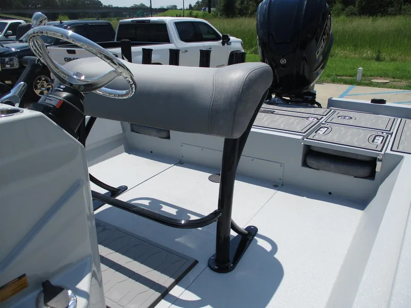Slide: The Image of 2025 Avid 23 Mag boat interior with steering wheel and seating. - 11