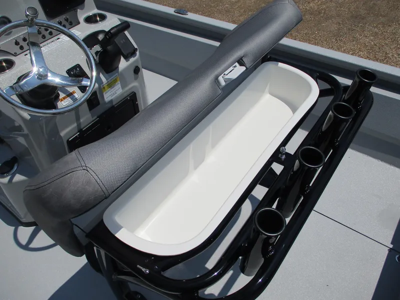 Slide: The Image of Avid 23 Mag 2025 boat console with rod holders and storage compartment. - 12