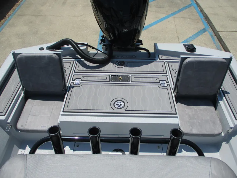 Slide: The Image of 2025 Avid 23 Mag boat interior with seating and rod holders. - 13