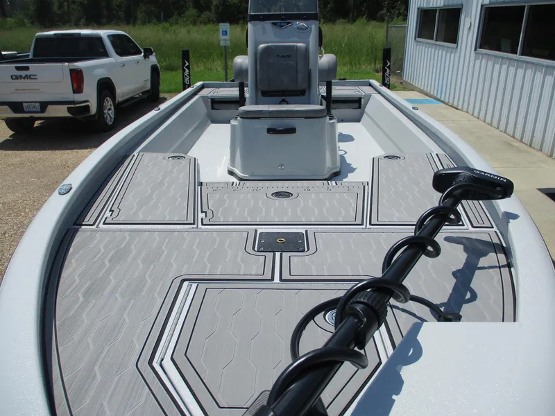 Slide: The Image of 2025 Avid 23 Mag boat with sleek deck design and modern features. - 2