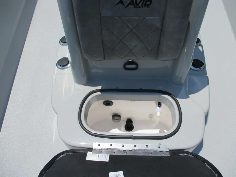 Slide: The Image of Avid 23 Mag 2025 boat livewell with open lid, showcasing interior features. - 20
