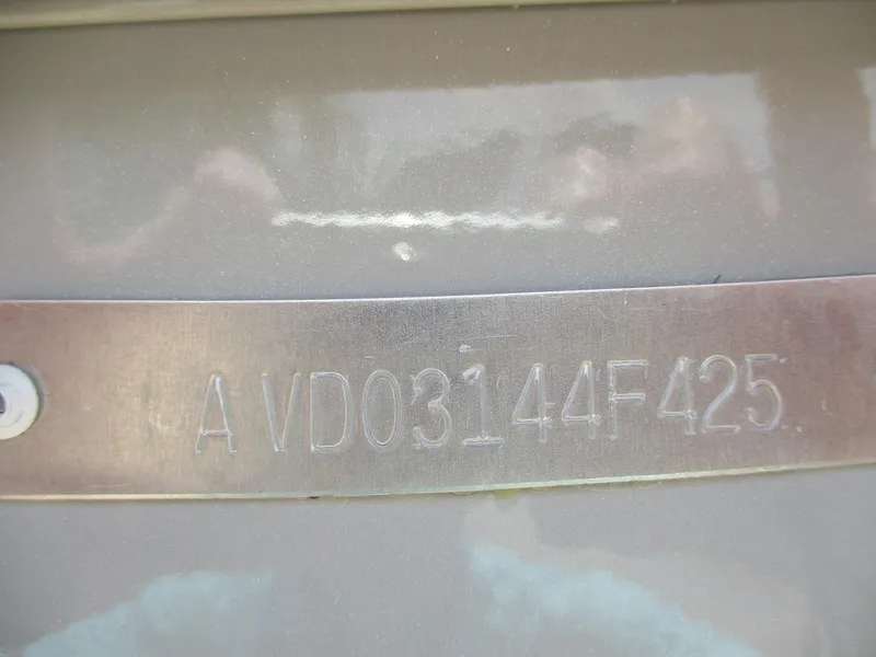 Slide: The Image of Avid 23 Mag 2025 model with serial number AVD03144F425 engraved on metal plate. - 24