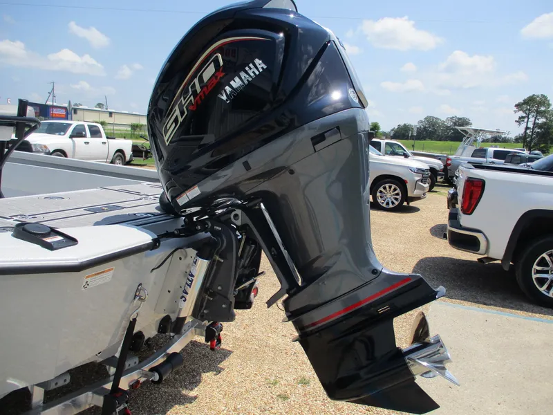 Slide: The Image of Avid 23 Mag 2025 boat with Yamaha outboard motor in parking lot. - 7