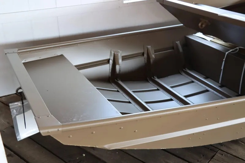 Slide: The Image of 2025 Starcraft 1436 JON TS boat interior, aluminum construction, sturdy design. - 2