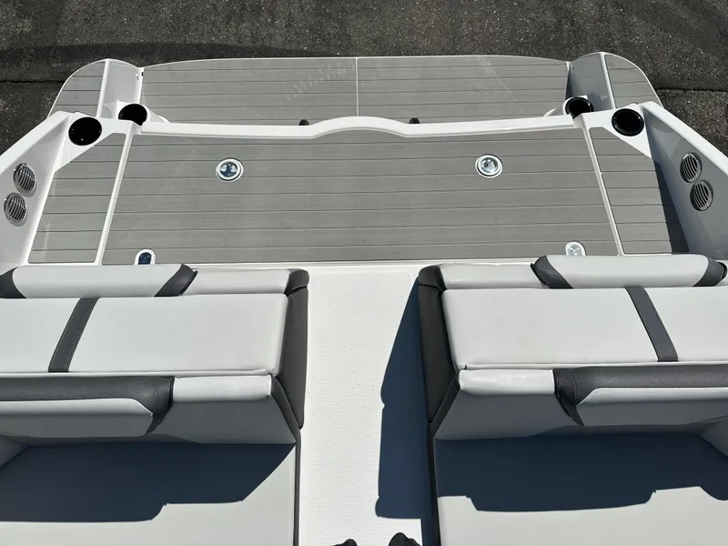 Slide: The Image of 2025 Yamaha Boats AR220 deck with cushioned seating and sleek design. - 17