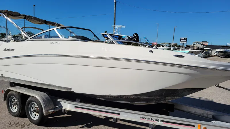 Slide: The Image of 2020 Hurricane SD 217 PROJECT boat on trailer, sunny day, marina background. - 0