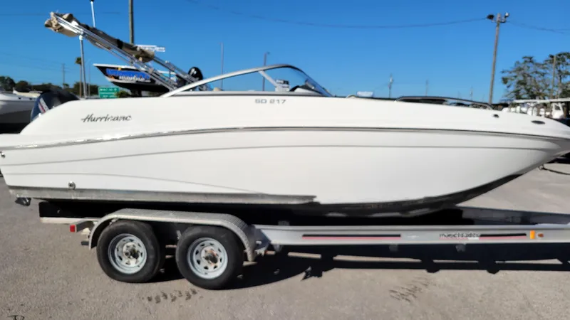 Slide: The Image of 2020 Hurricane SD 217 PROJECT boat on trailer, side view, outdoors. - 1