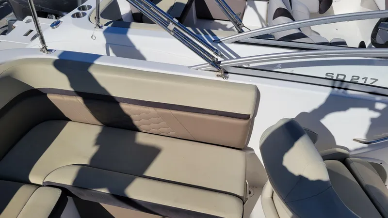 Slide: The Image of 2020 Hurricane SD 217 PROJECT boat interior with beige seating and chrome railings. - 10
