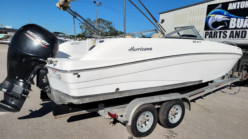 Slide: The Image of 2020 Hurricane SD 217 PROJECT boat on trailer with Mercury outboard motor. - 2