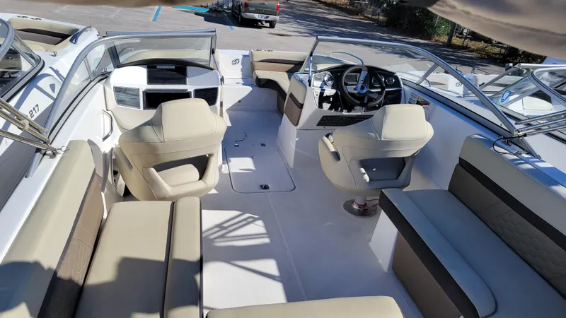 Slide: The Image of 2020 Hurricane SD 217 PROJECT boat interior with beige seating and modern dashboard. - 8