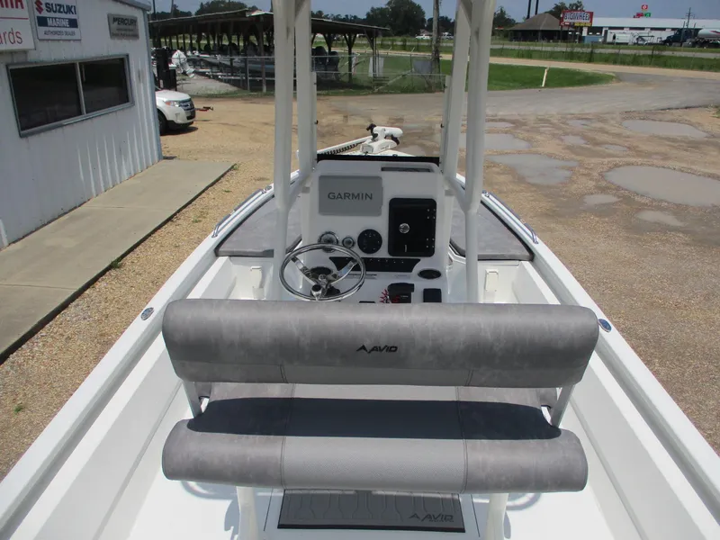 Slide: The Image of Avid 23 Fusion 2025 boat interior with Garmin navigation system and seating. - 11