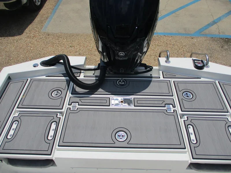 Slide: The Image of Avid 23 Fusion 2025 boat deck with storage compartments and motor. - 12