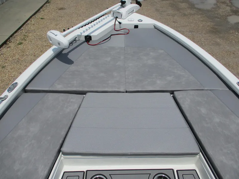 Slide: The Image of Avid 23 Fusion 2025 boat deck with gray cushioned seating and trolling motor. - 14