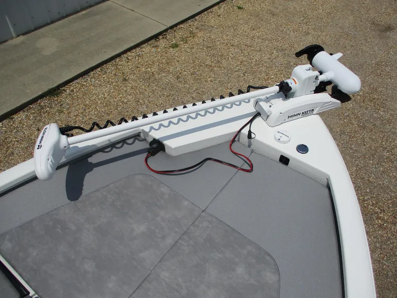 Slide: The Image of Avid 23 Fusion 2025 boat with trolling motor on deck. - 18