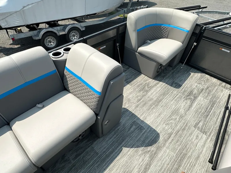 Slide: The Image of 2024 Qwest E 816 RLS LT boat interior with gray seating and blue accents. - 5