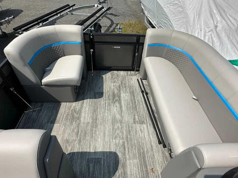 Slide: The Image of 2024 Qwest E 816 RLS LT pontoon boat interior with gray seating and blue accents. - 6