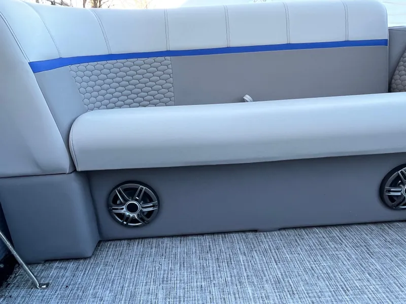 Slide: The Image of 2024 Qwest 814 CTR Fish L boat seat with speakers, gray upholstery, and blue accent. - 10