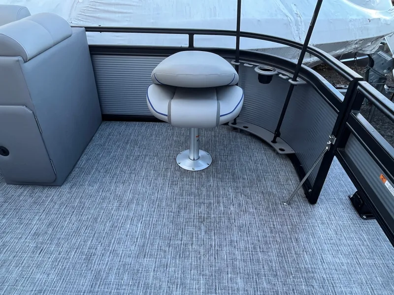 Slide: The Image of 2024 Qwest 814 CTR Fish L boat interior with gray seating and carpet. - 11