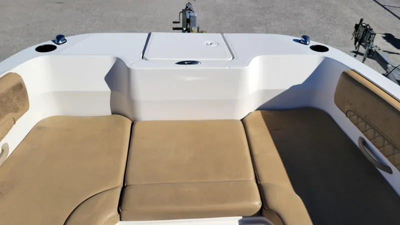 Slide: The Image of Bayliner DX2200 PROJECT 2020 boat interior with beige seating and storage compartment. - 14