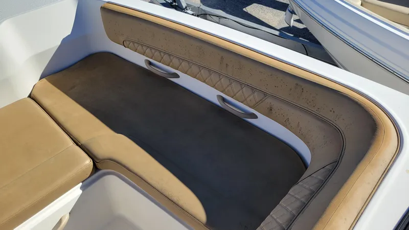 Slide: The Image of 2020 Bayliner DX2200 PROJECT boat interior with tan seating and white accents. - 15
