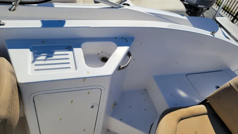 Slide: The Image of 2020 Bayliner DX2200 PROJECT boat interior with seating and storage compartments. - 18