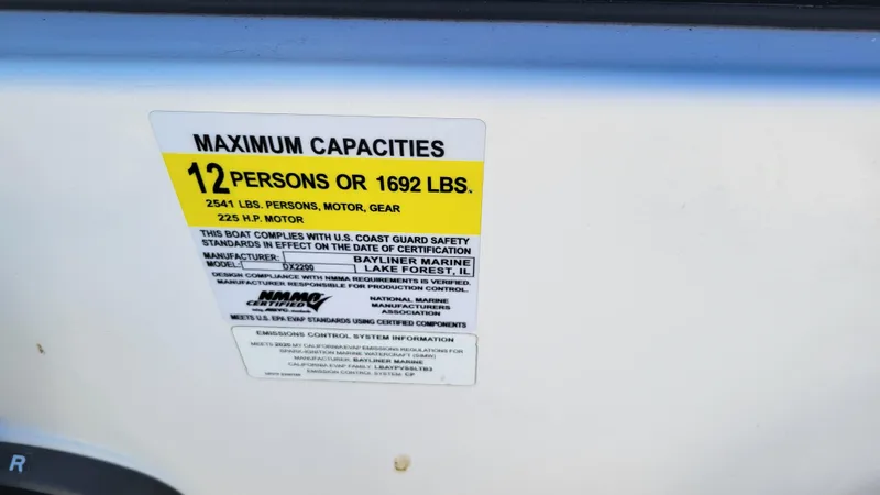 Slide: The Image of Bayliner DX2200 PROJECT 2020 capacity label: 12 persons or 1692 lbs. - 20