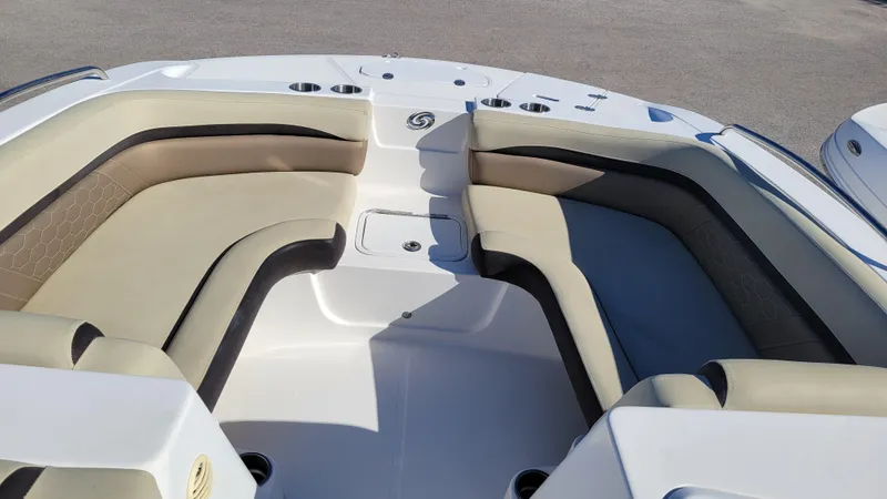 Slide: The Image of 2020 Hurricane SS 192 PROJECT boat interior with beige seating and cup holders. - 10