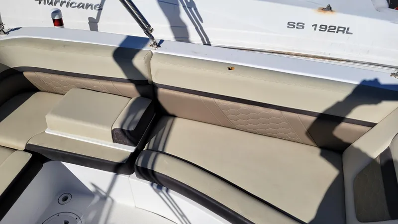 Slide: The Image of 2020 Hurricane SS 192 PROJECT boat interior with beige seating and white accents. - 12