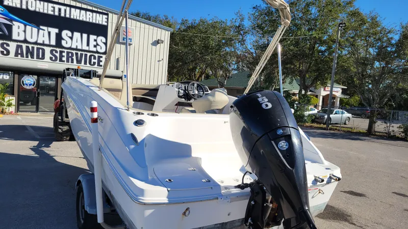 Slide: The Image of Hurricane SS 192 PROJECT 2020 boat at dealership, featuring outboard motor and spacious deck. - 5