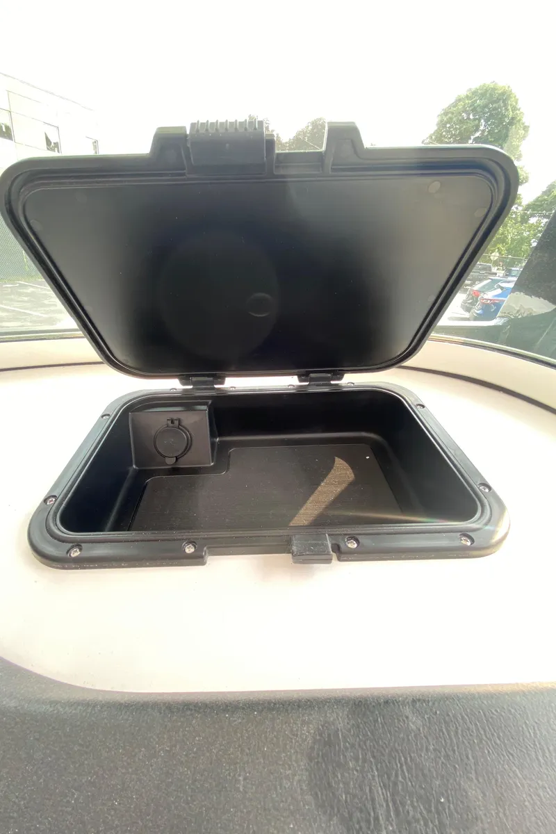 Slide: The Image of Open storage compartment on 2024 Sea Pro 242 Center Console boat. - 10