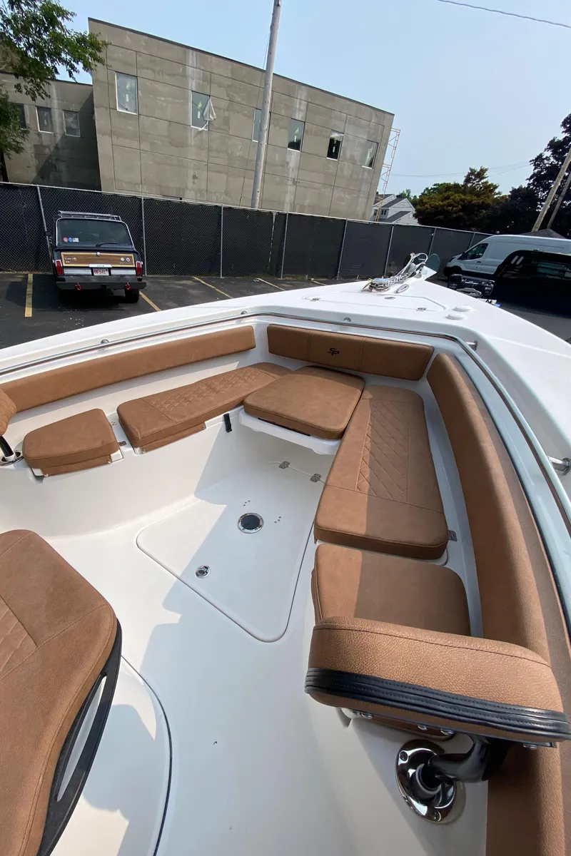 Slide: The Image of 2024 Sea Pro 242 Center Console boat with spacious seating and modern design. - 13