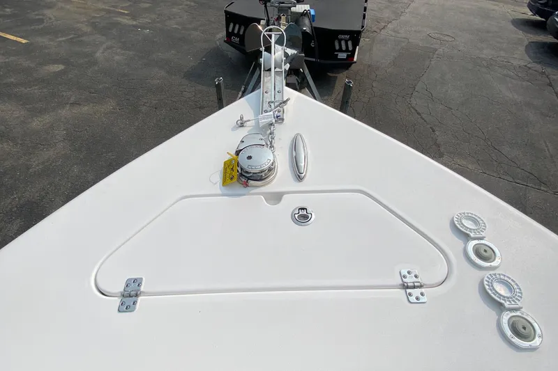 Slide: The Image of 2024 Sea Pro 242 Center Console boat deck with anchor and hatch. - 16