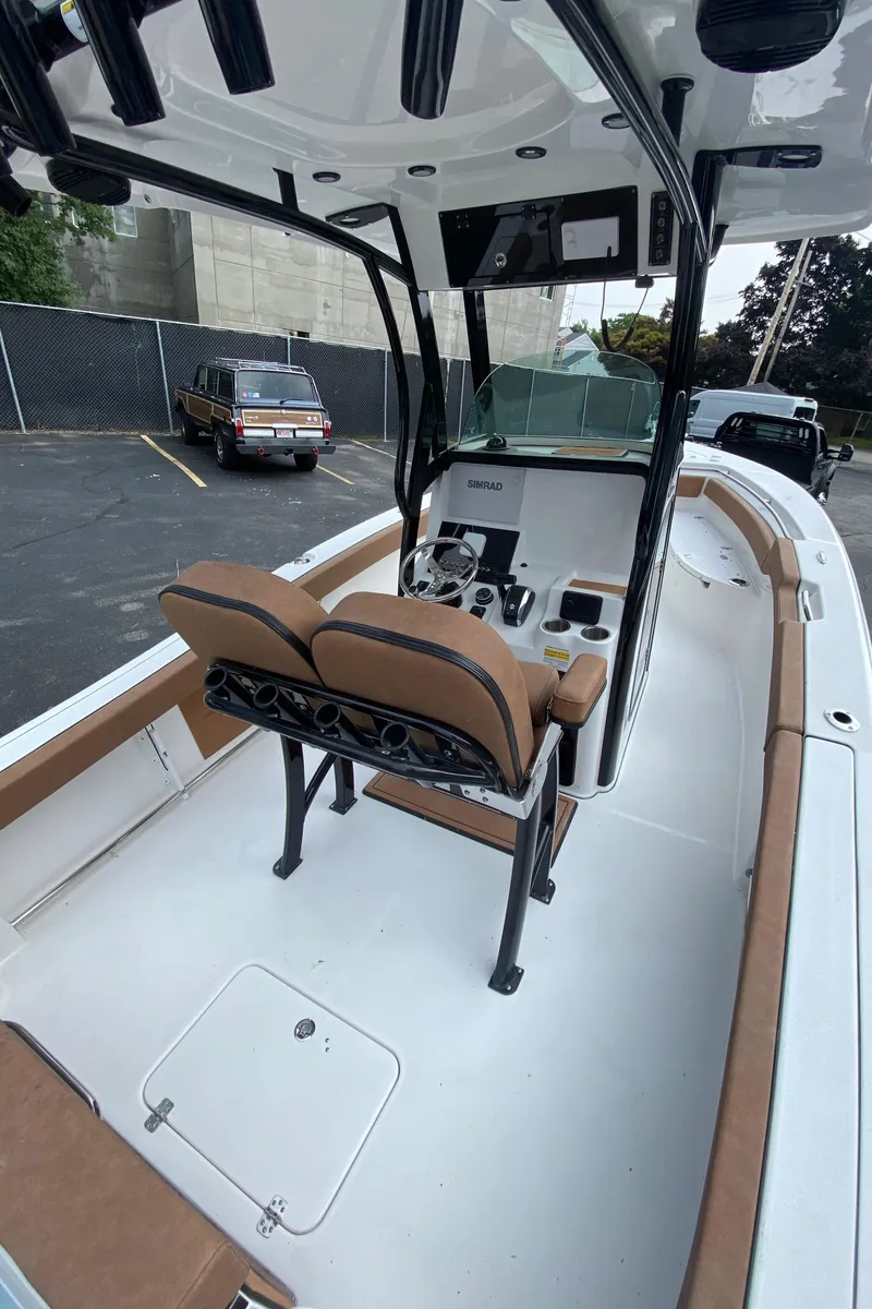 Slide: The Image of 2024 Sea Pro 242 Center Console boat with dual seats and modern dashboard. - 6
