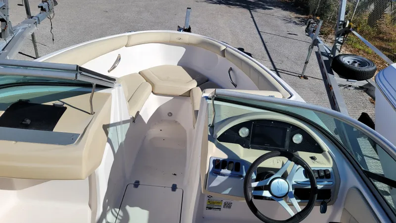 Slide: The Image of 2020 Regal 21 OBX PROJECT boat interior with steering wheel and seating area. - 10