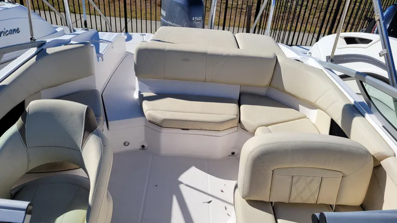 Slide: The Image of 2020 Regal 21 OBX PROJECT boat interior with beige seating and spacious layout. - 11
