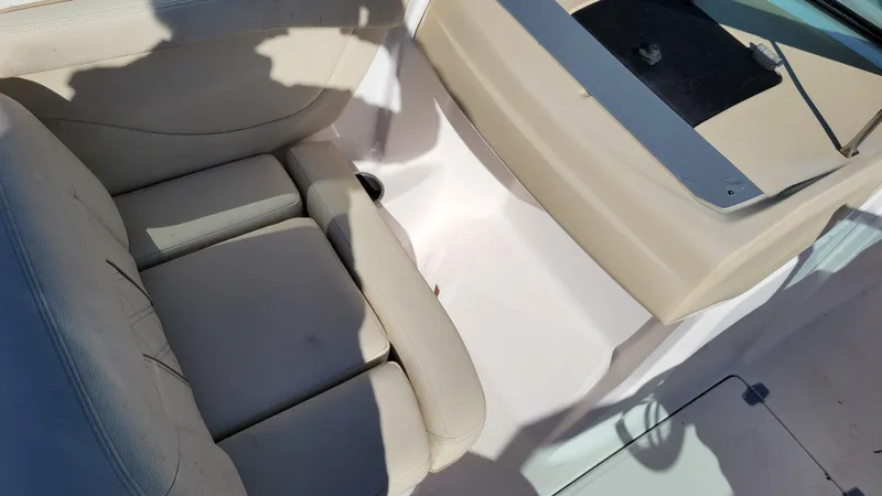 Slide: The Image of 2020 Regal 21 OBX PROJECT boat interior with beige seating and clean design. - 13