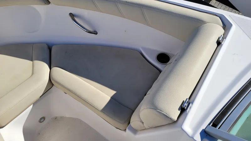 Slide: The Image of 2020 Regal 21 OBX PROJECT boat interior seating with cup holder. - 16