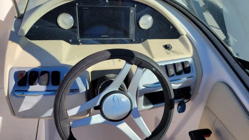 Slide: The Image of 2020 Regal 21 OBX PROJECT boat dashboard with steering wheel and control panel. - 19