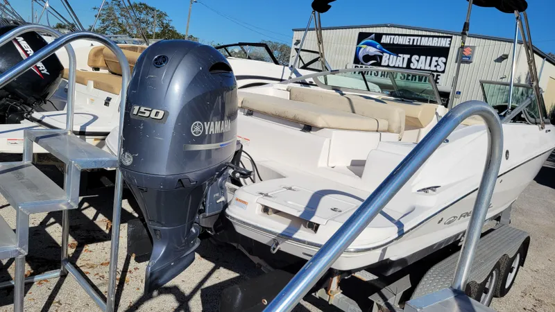 Slide: The Image of 2020 Regal 21 OBX PROJECT boat with Yamaha 150 engine at dealership. - 2