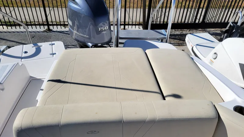 Slide: The Image of 2020 Regal 21 OBX PROJECT boat with Yamaha 150 outboard motor, beige seating. - 21